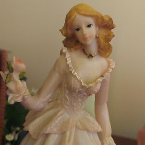 Elegant Porcelain Figurine with Rose